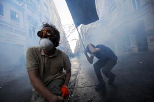 Protestors clash with Turkish riot policemen during a protest ag