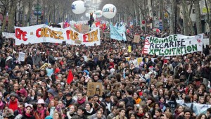 Thousands of people demonstrate 07 March 2006 in Paris during a nationwide protest over the government's youth job plan, the first employment contract (CPE), a permanent work contract for those under 26, which allows an employer to lay off the employee during the first two years of employment. Critics have said it undermines French labour laws and will make it more difficult for young people to find long-term jobs. French Prime Minister Dominique de Villepin finally used a special constitutional power to force the CPE through parliament without a vote, where the opposition had been stalling debate on the text. AFP PHOTO JACK GUEZ / AFP / JACK GUEZ